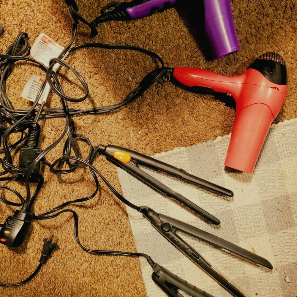 2 blow dryers and 3 hair straightener
